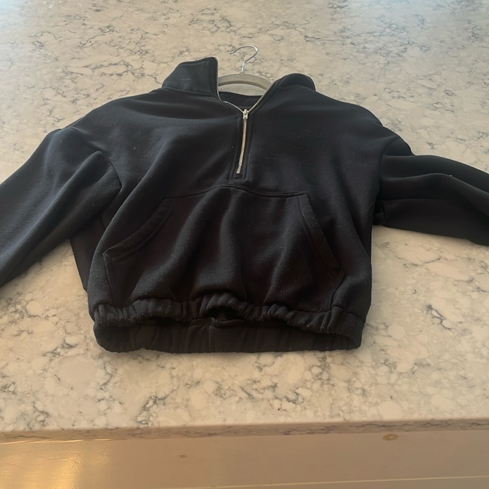 Black sweater zip up.